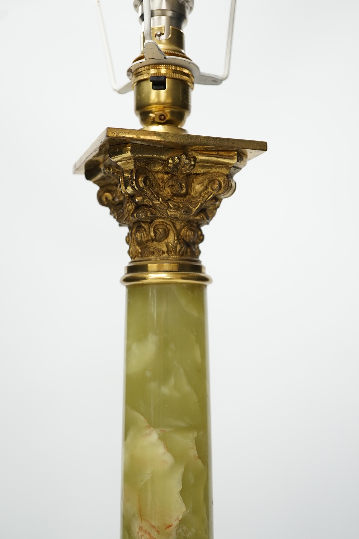 An early 20th century green onyx and brass Corinthian column table lamp, 43cm to top of column. Condition - fair to good, not tested as working
